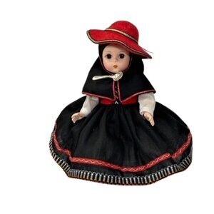 Madame Alexander restrung 8" Peru doll with stand.